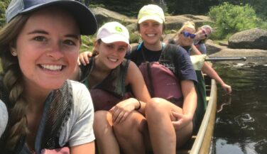 Cecilia Meyerson and bachelorettes in a canoe in the BWCA